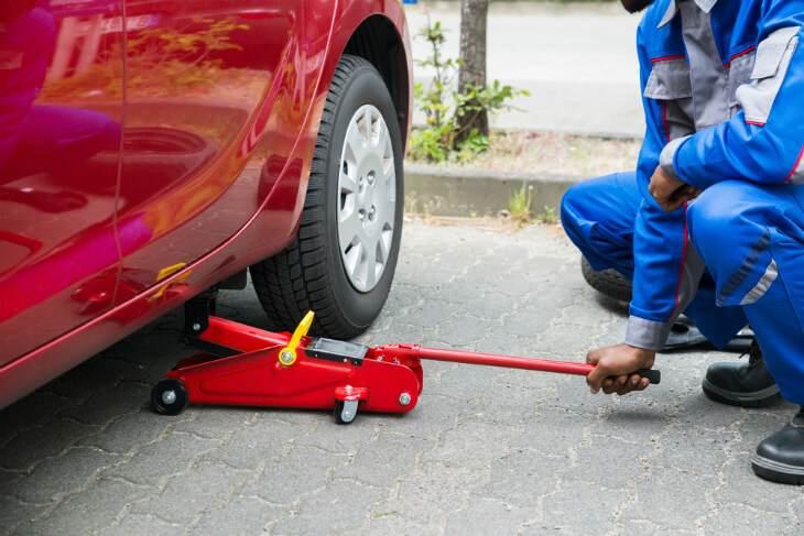 Place The Floor Jack Under The Jacking Point To Lift The Vehicle